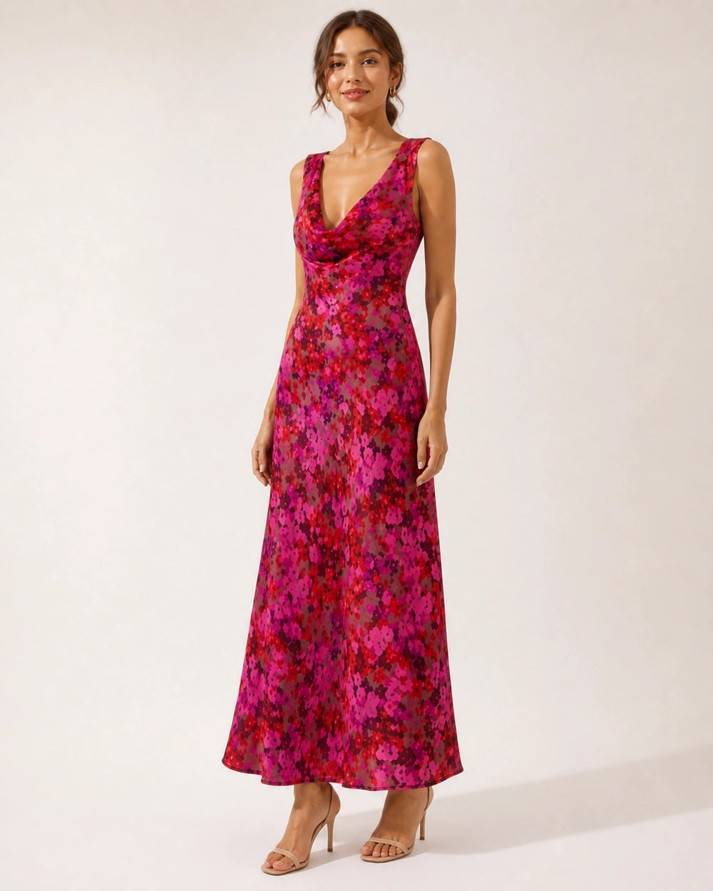 Women's pink floral sleeveless cowl-neck bias-cut maxi dress, front three-quarter fit view.