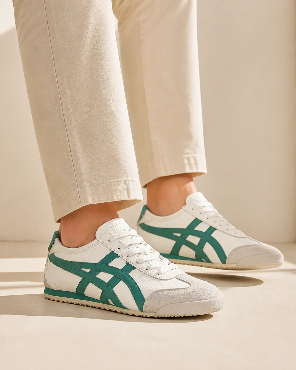 Men wearing grey-green retro panel sneakers, close product-first view.