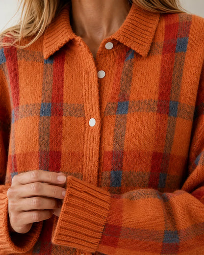 Orange checked knit collar, buttons and ribbed cuff detail.