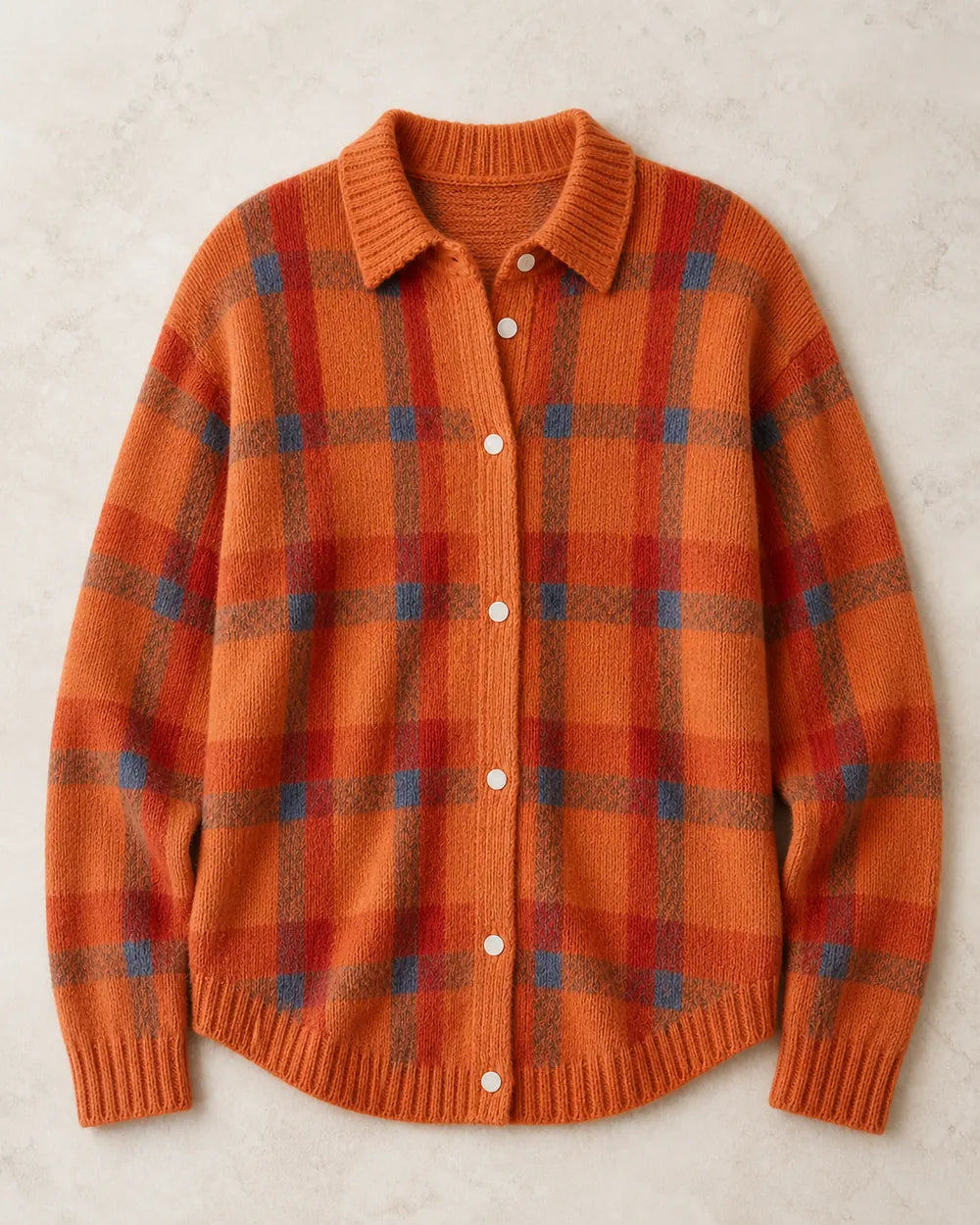 Orange checked button-front knit, clean flat lay.