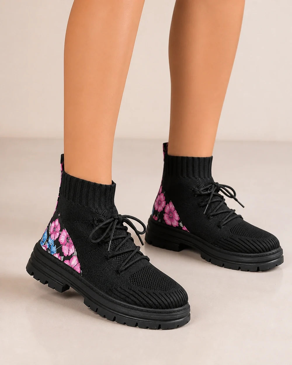 Black knit sock ankle boots worn zoomed hero