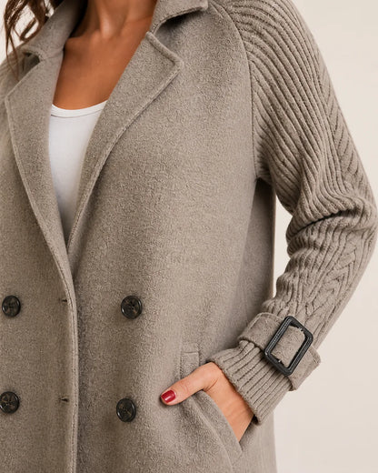 Taupe coat lapel button pocket and knit cuff detail.